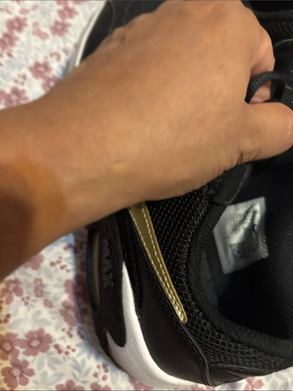 Nike Women's Black Sneakers with Subtle Gold Accent